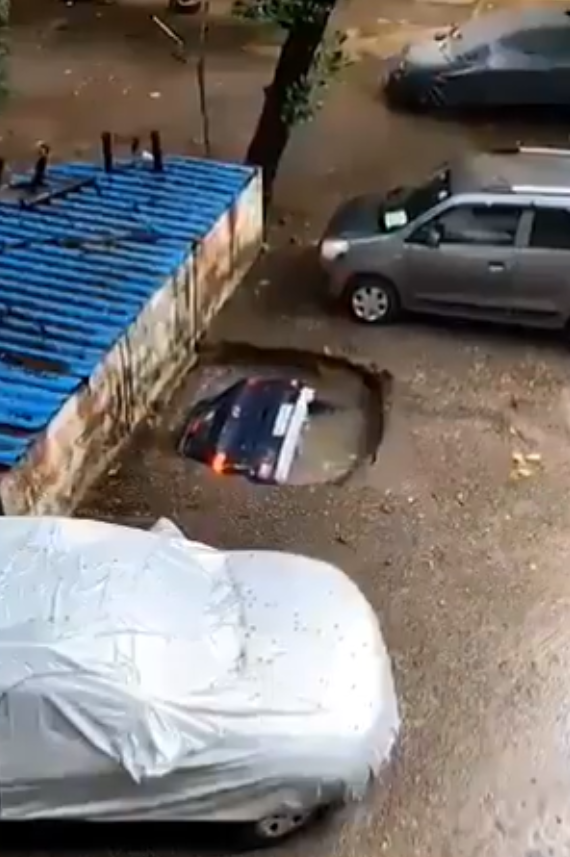 Terrifying footage shows car being 'swallowed' whole by a sinkhole