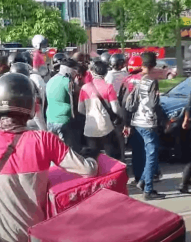 [video] horde of angry delivery riders confront lorry driver following collision
