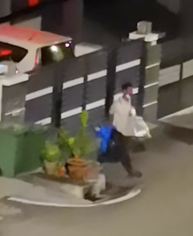 Desperate times: man scavenges for food from rubbish bin at 3am