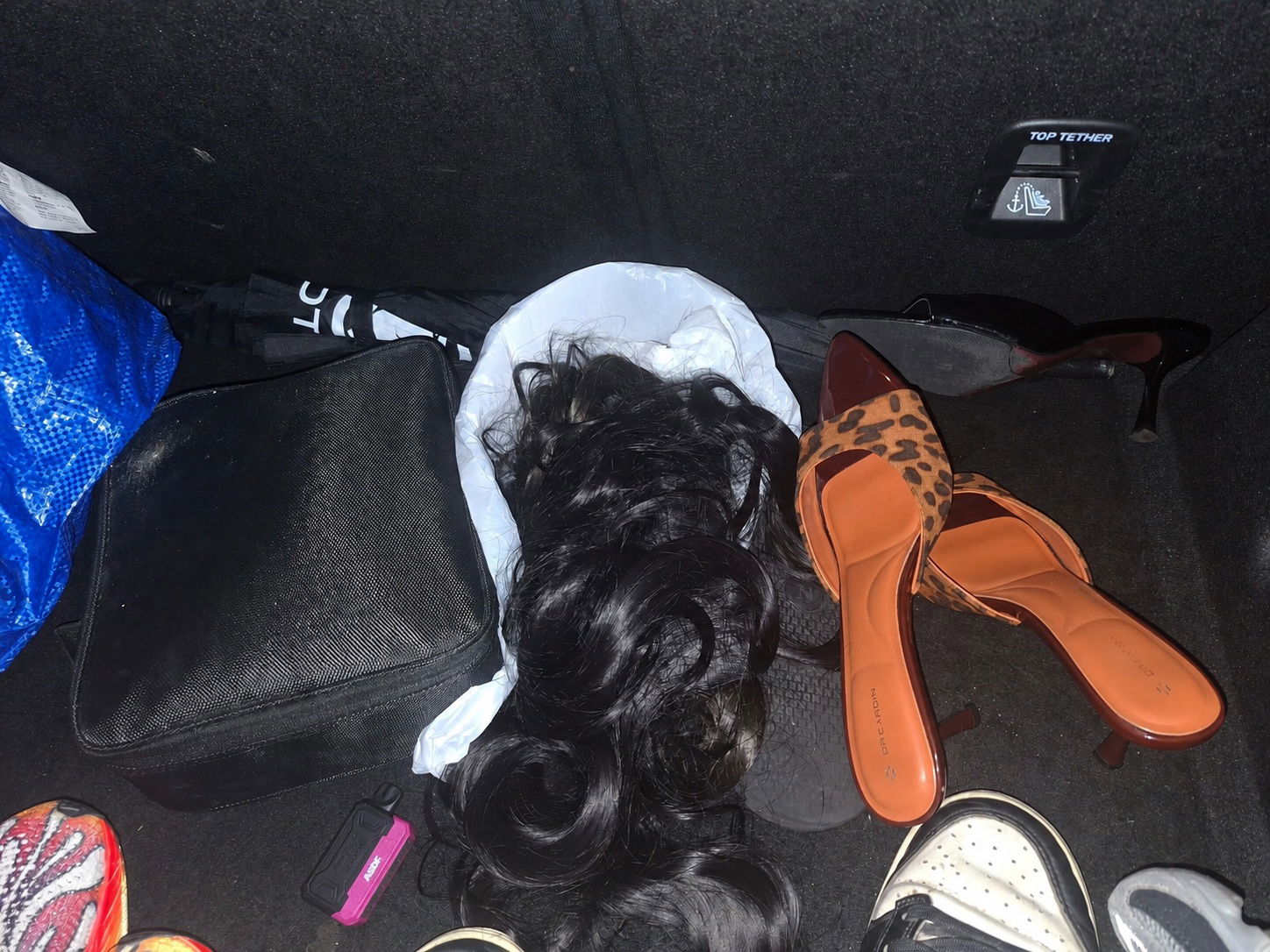 wk wig n heels inside car boot