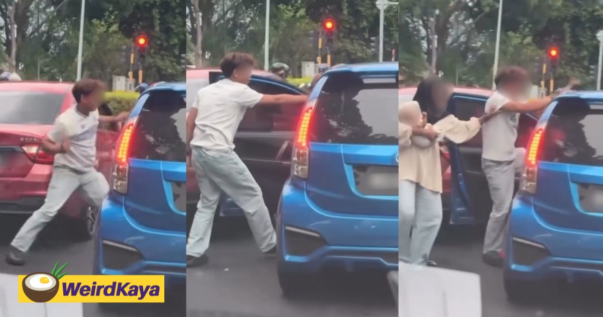 M’sian Man Seen Hitting Myvi Driver In Viral Clip, Woman Tries To Stop Him While Carrying Baby | WeirdKaya