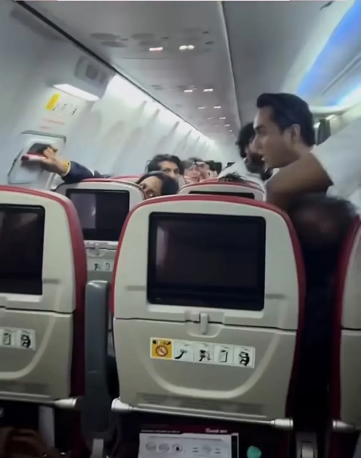 wk passenger from india allegedly tries to force open emergency exit on kl kochi flight, gets arrested....