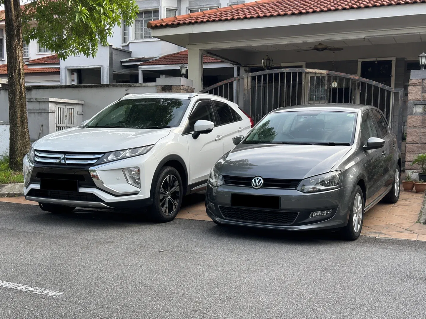 wk two cars outside a suburban home