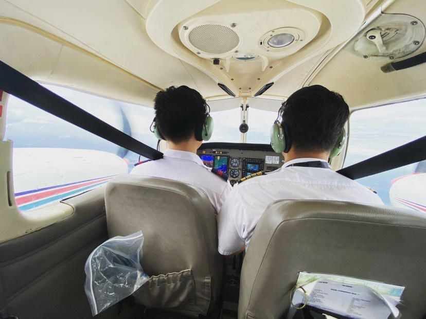 Malaysian pilot flying in an airplane