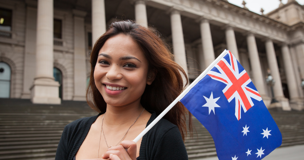 Australian woman holding australian flag