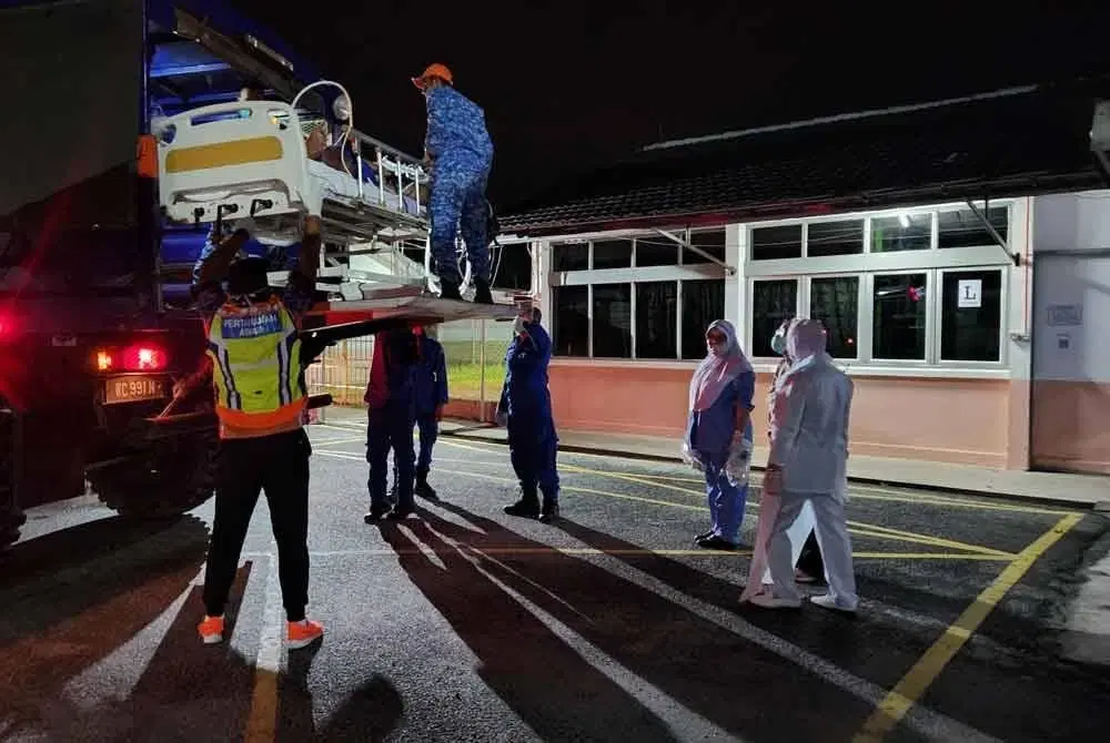 Overweight man transferred from ambulance to truck