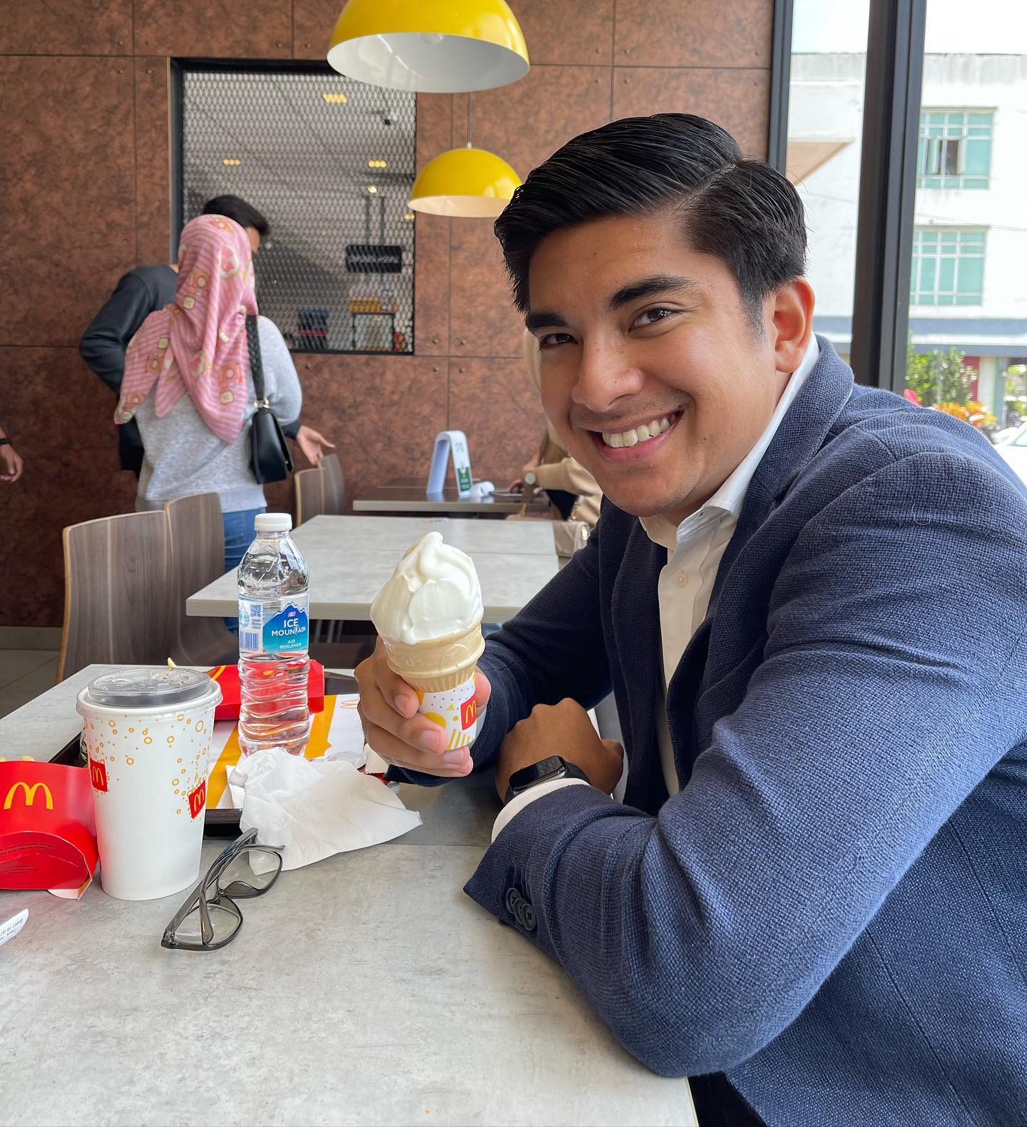 Syed saddiq eating ice cram from mcdonald's