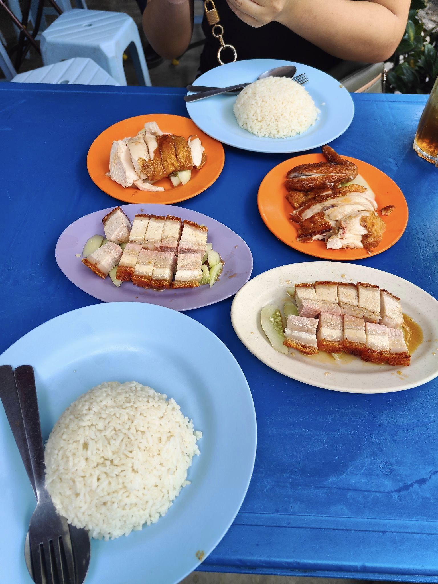 Chicken and pork rice served on a table