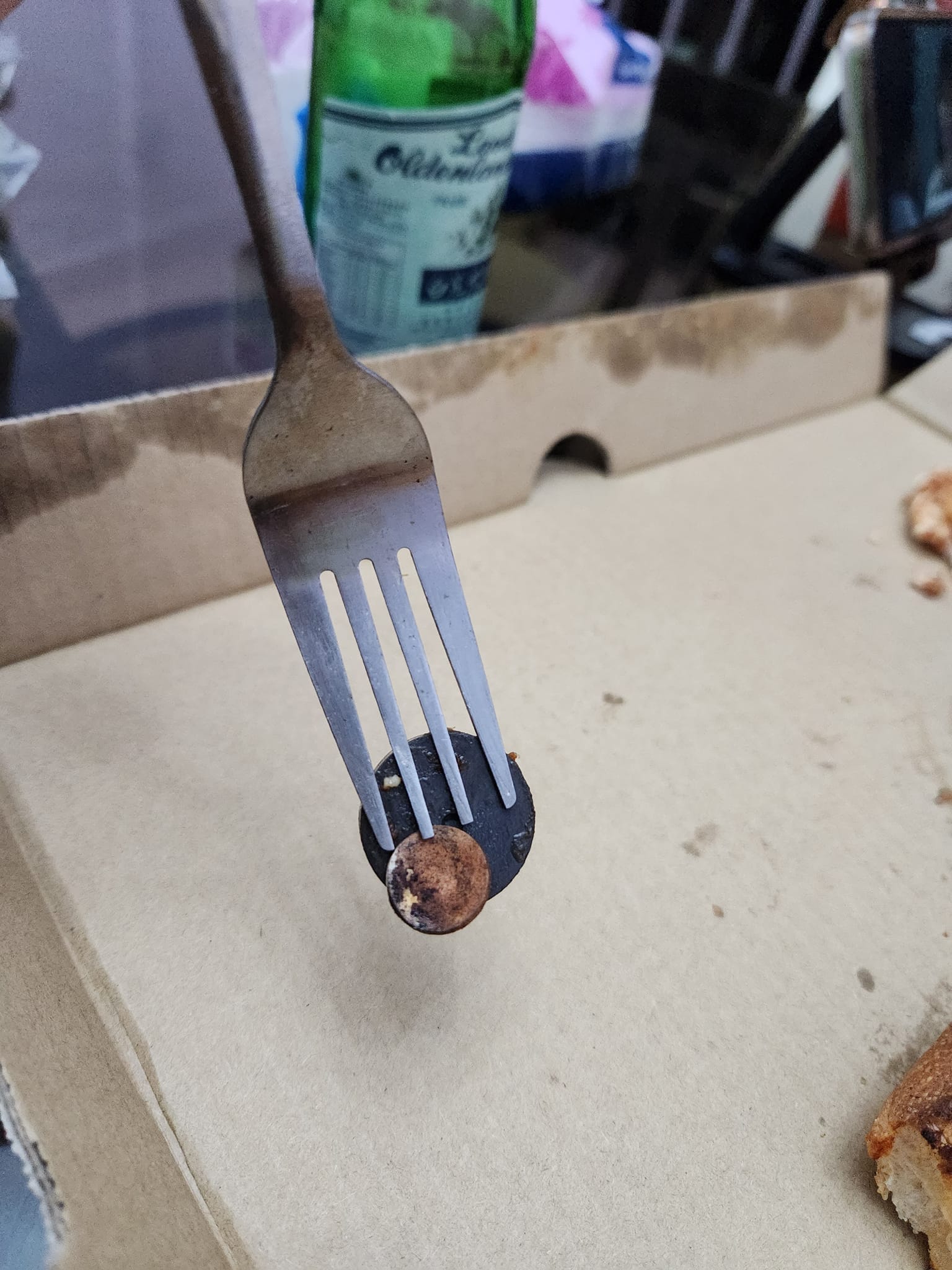 The magnet attached to the metal fork