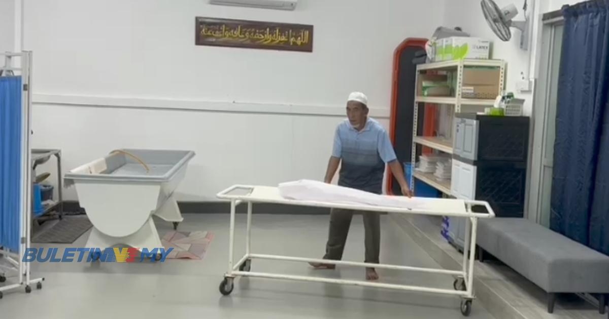 A man moving the stretcher that has the body of a baby corpse