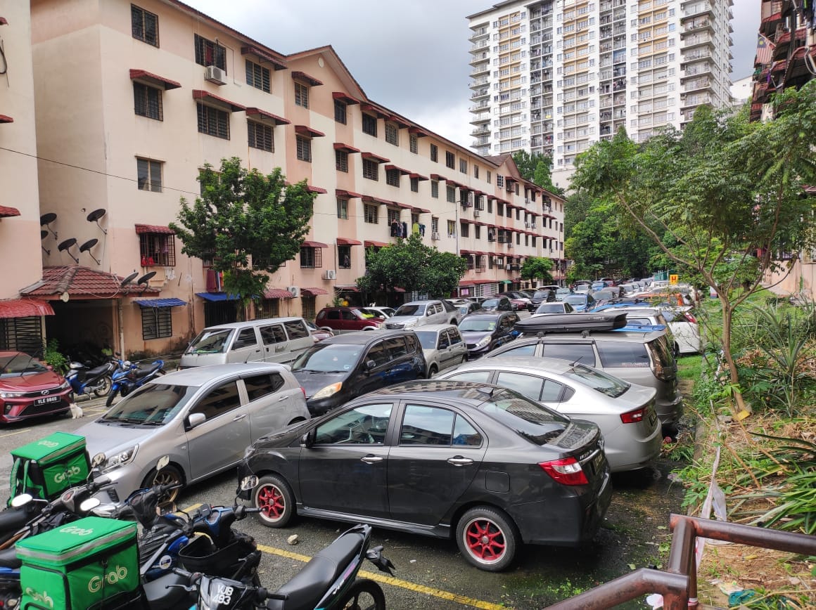 Cars parked in front of an apartment