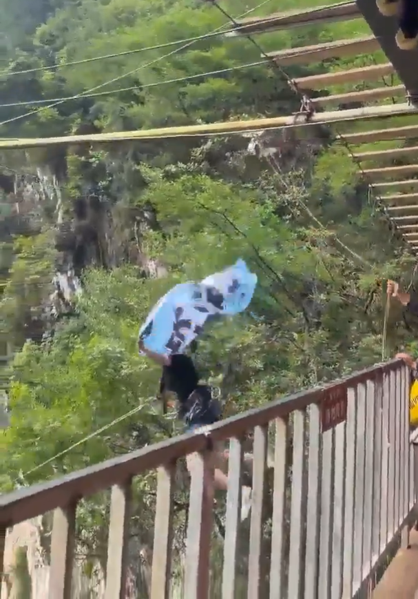 Image from: Woman Plunges Off Cliff In China Despite Telling Staff Safety Rope Wasn’t ‘Tight Enough’ | WeirdKaya