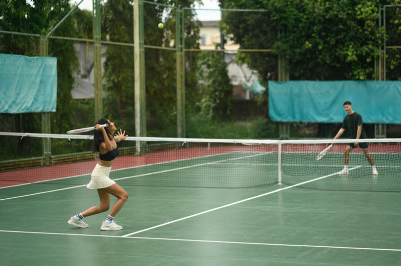 Couple playing tennis