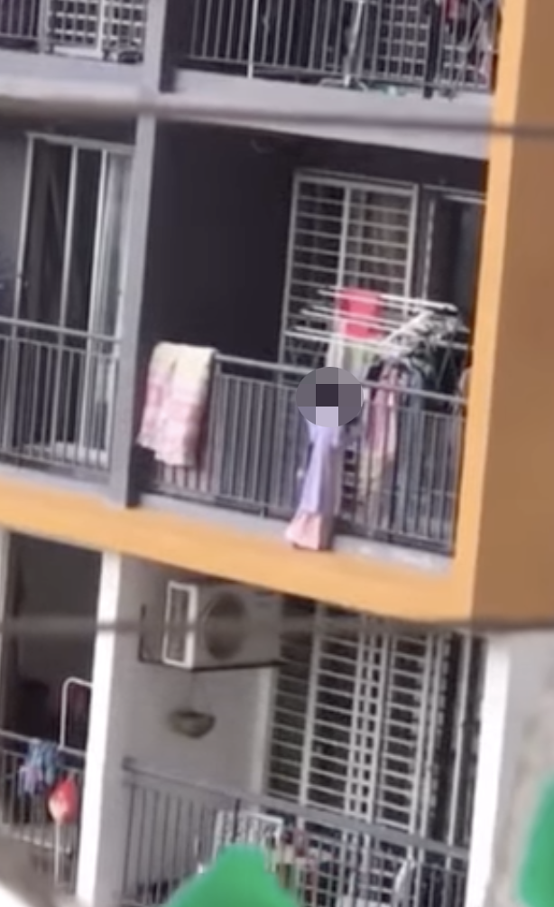 [video] young girl seen flirting with death by walking on the edge of apartment balcony | weirdkaya