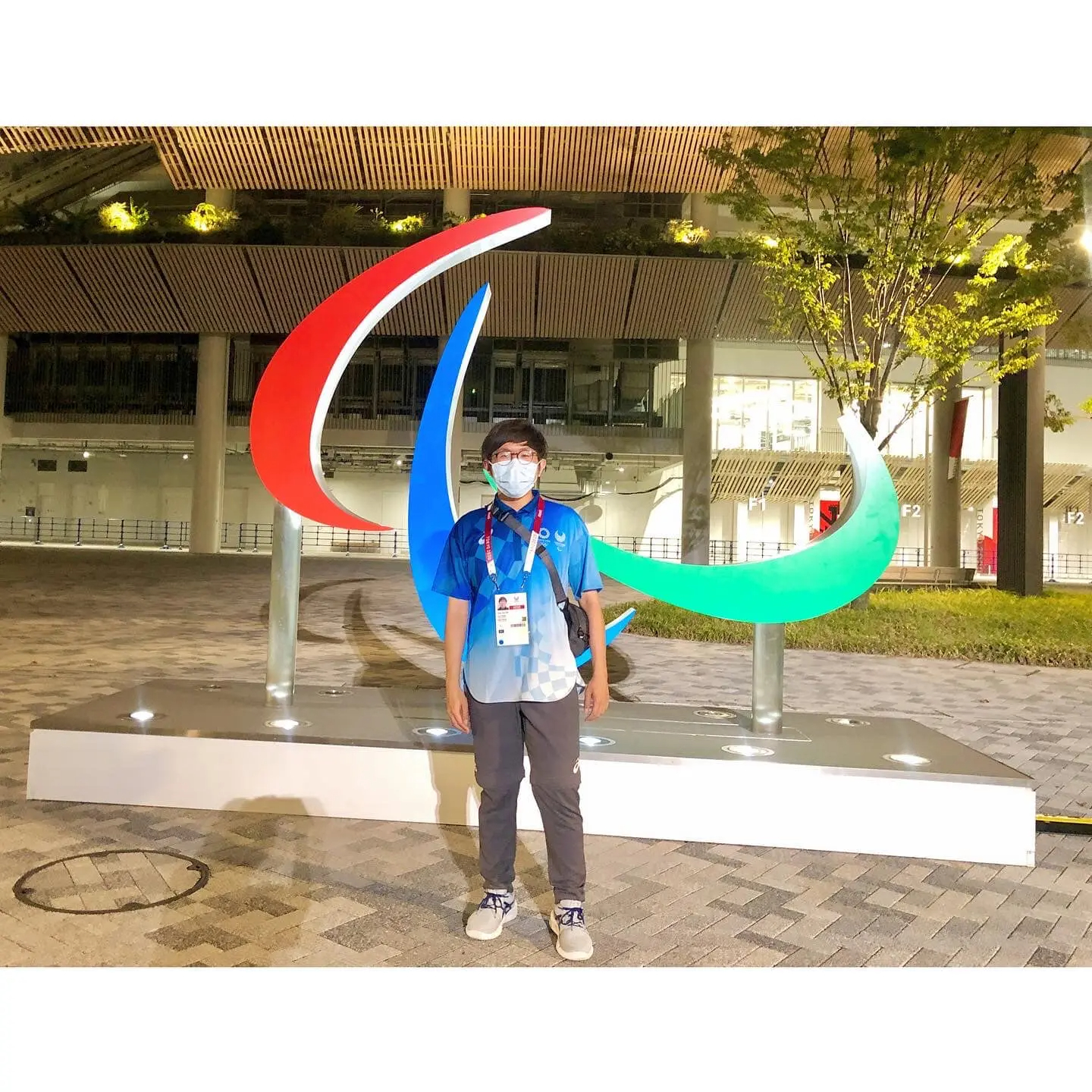 How yee in front of the tokyo olympics stadium.