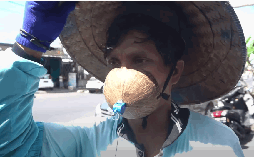 Man uses coconut shell as face mask because it's more 'comfortable' | weirdkaya