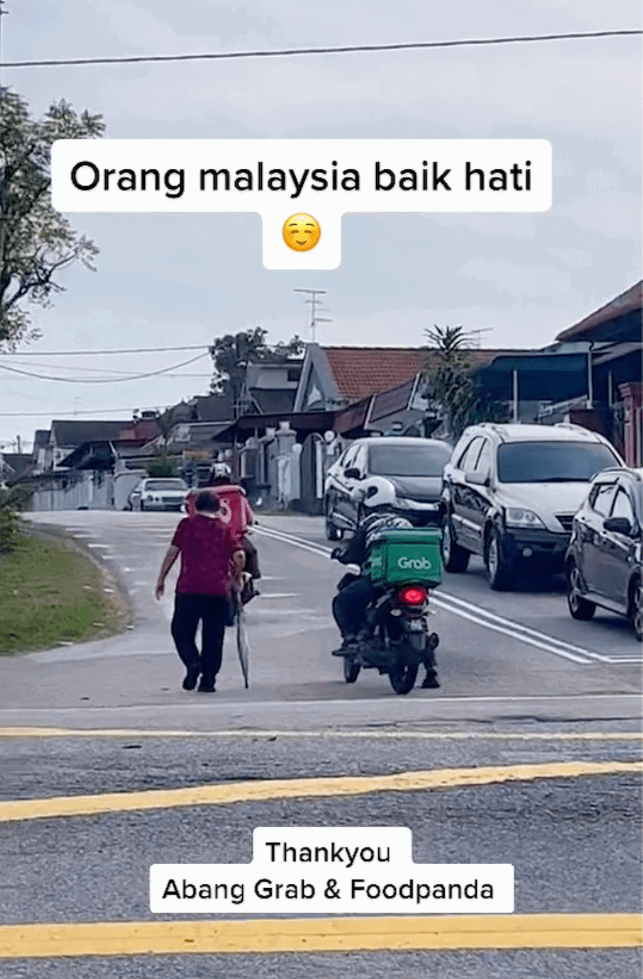 Kind food delivery riders 'escort' senior citizen to cross busy road, wins praises online 02