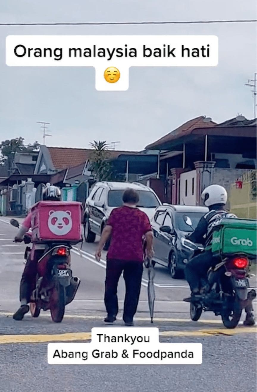 Kind food delivery riders 'escort' senior citizen to cross busy road, wins praises online 02