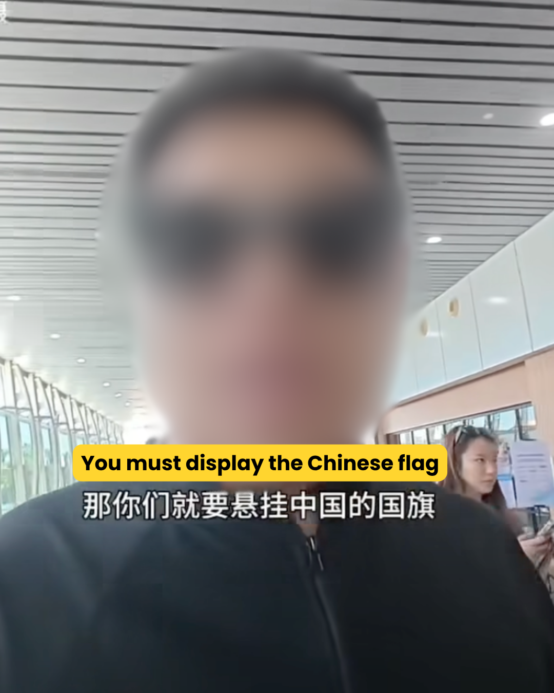 Man said must display Chinese flag to earn Chinese money