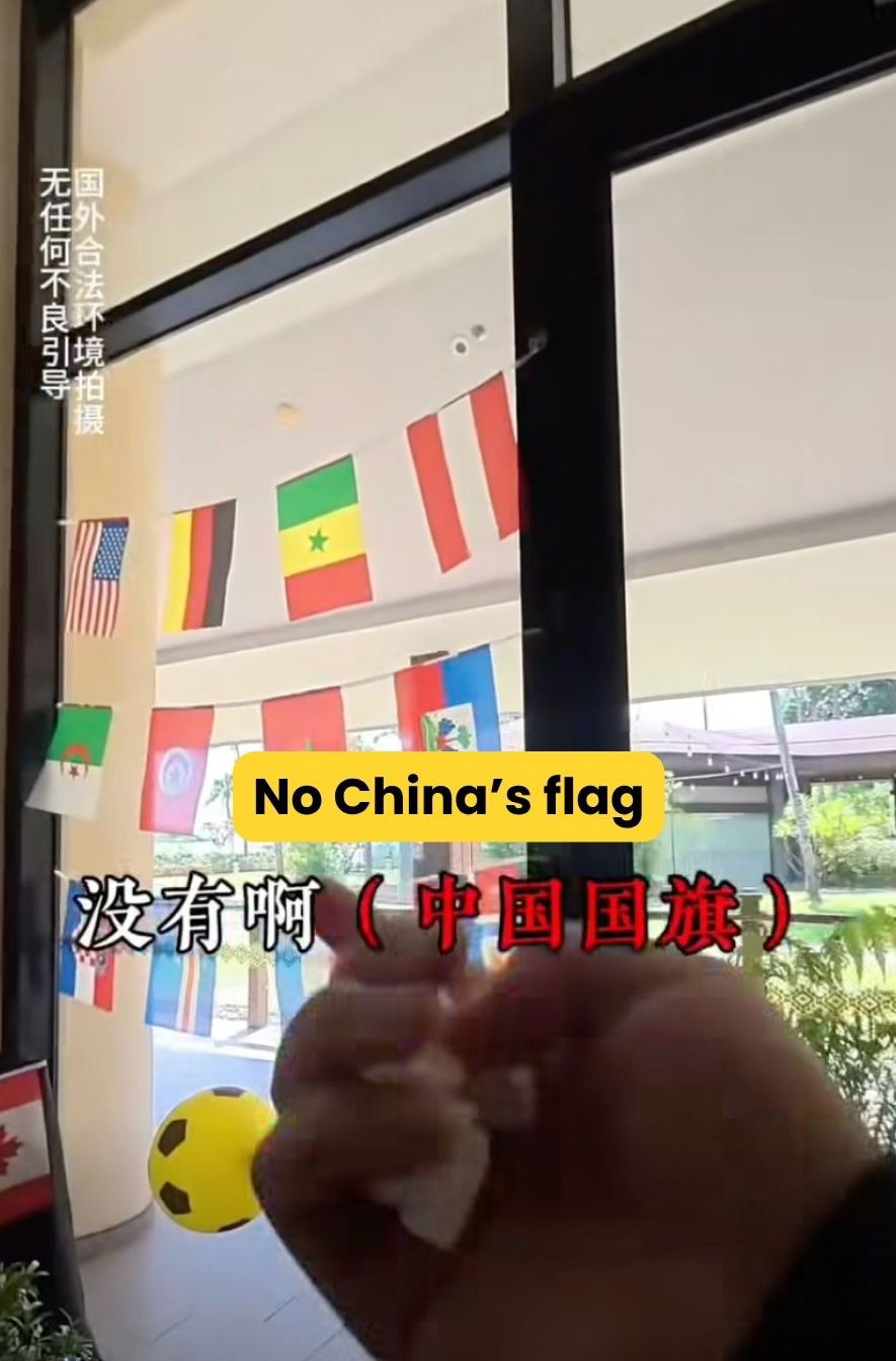 Man showing hotel didn't display Chinese flag