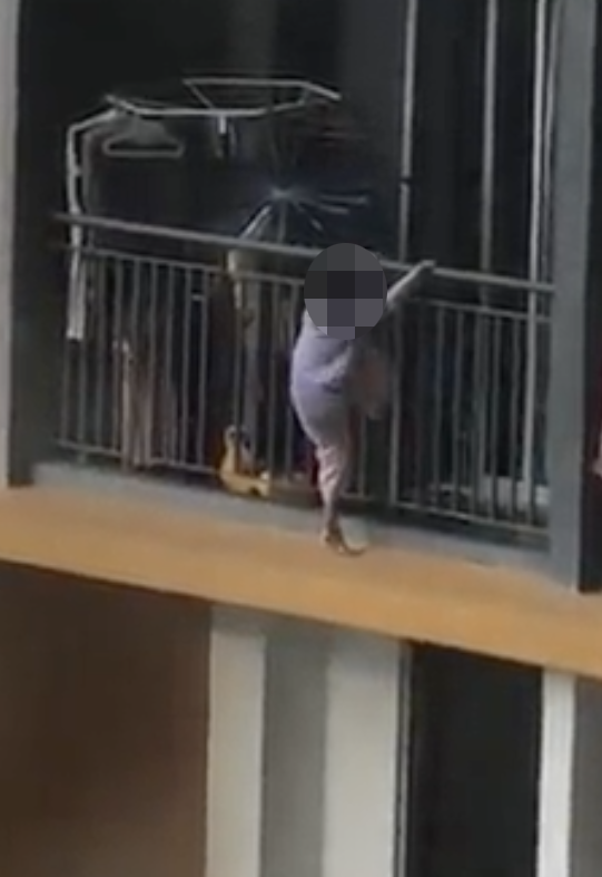 [video] young girl seen flirting with death by walking on the edge of apartment balcony | weirdkaya
