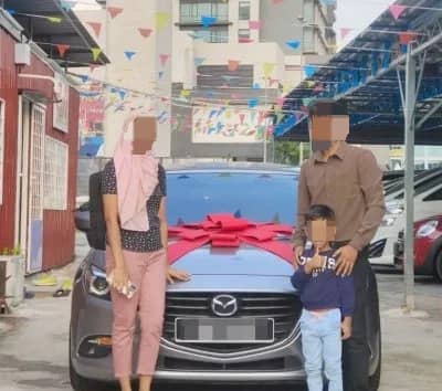 A family standing infront of a new car