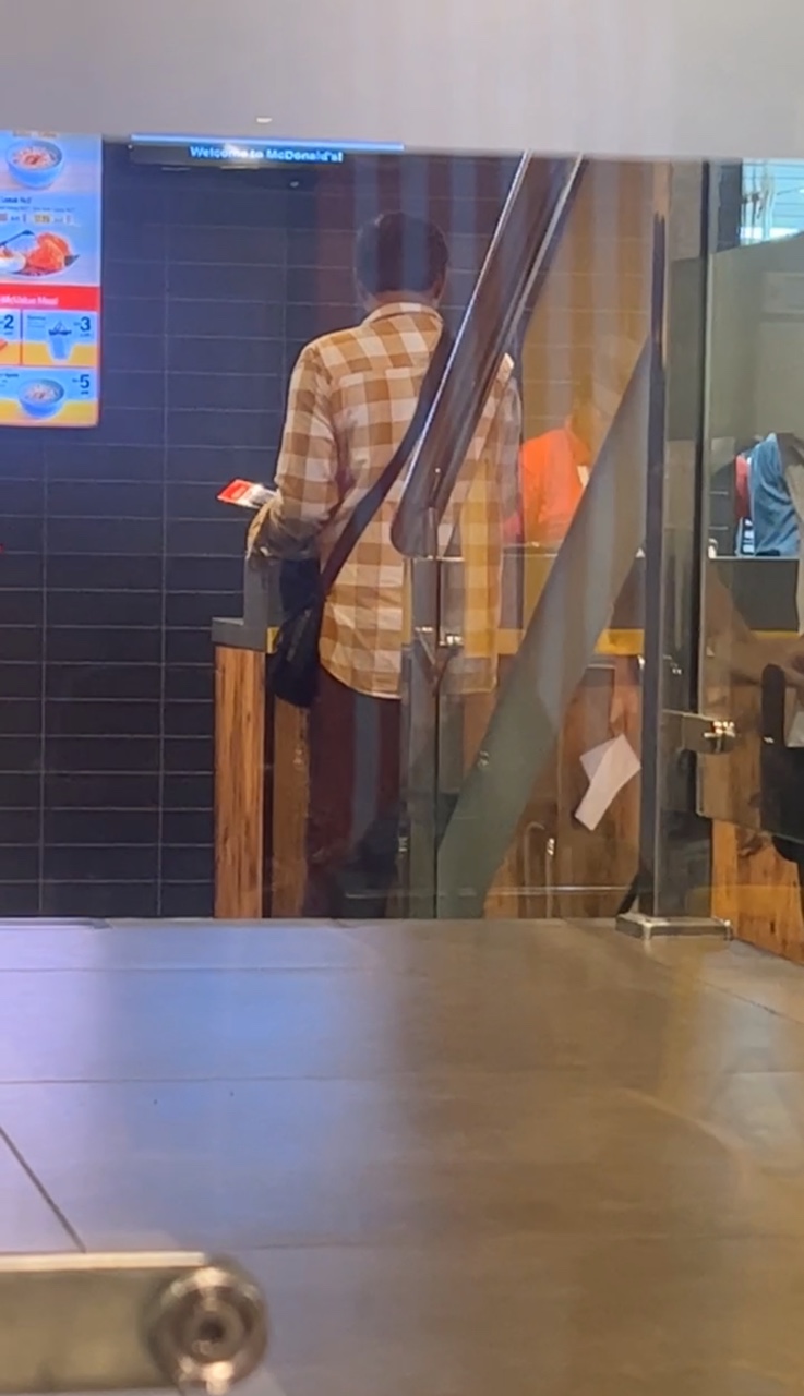 A man collecting food at the counter