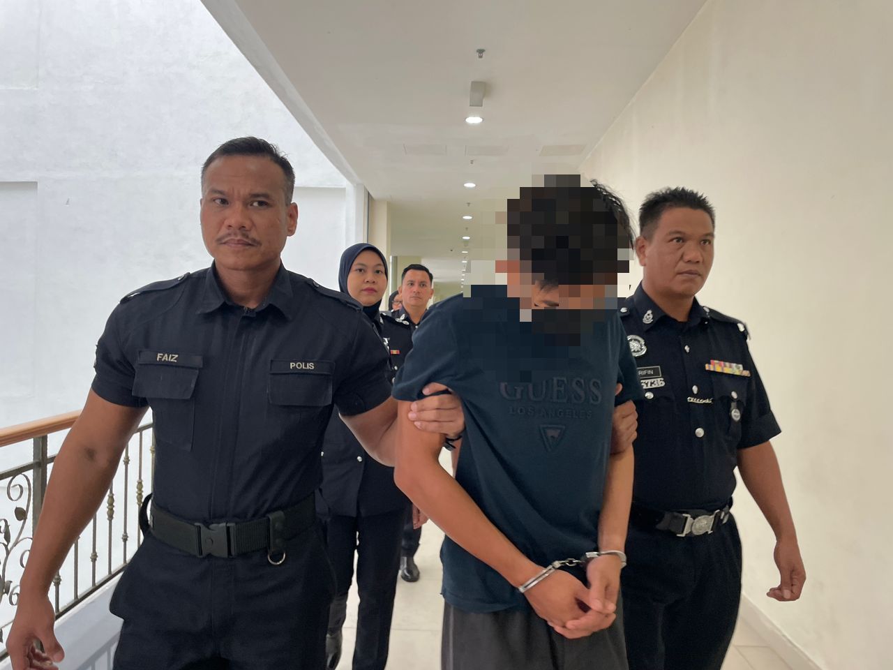 'abang bas' in handcuffs