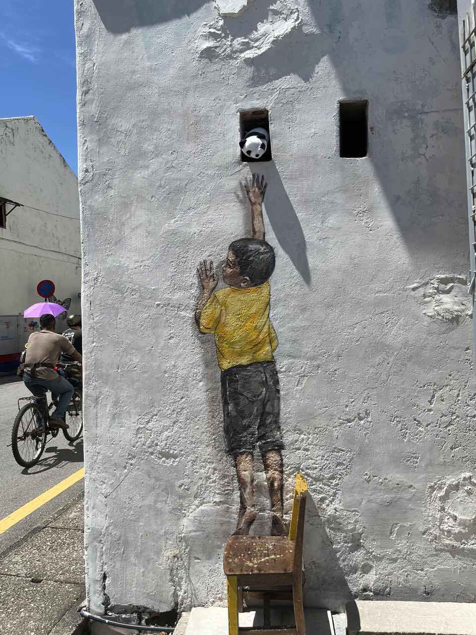 Boy on chair mural in penang