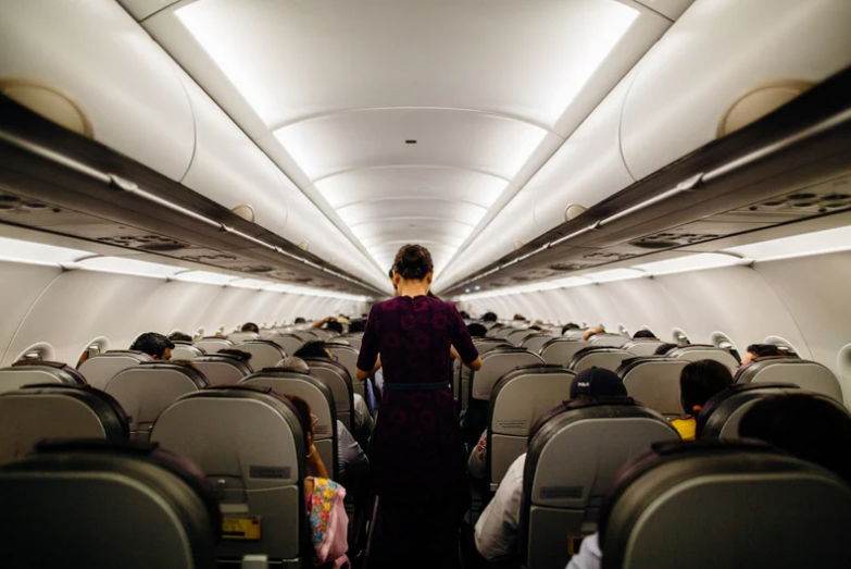 air stewardess inside a plane