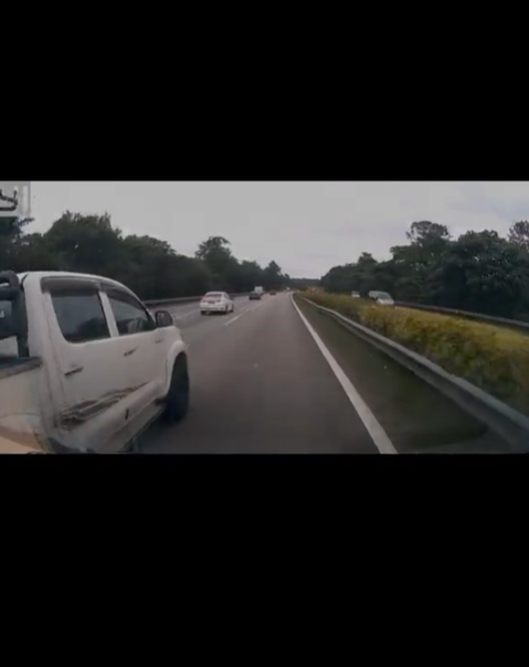 Ambulance overtakes hilux on the highway
