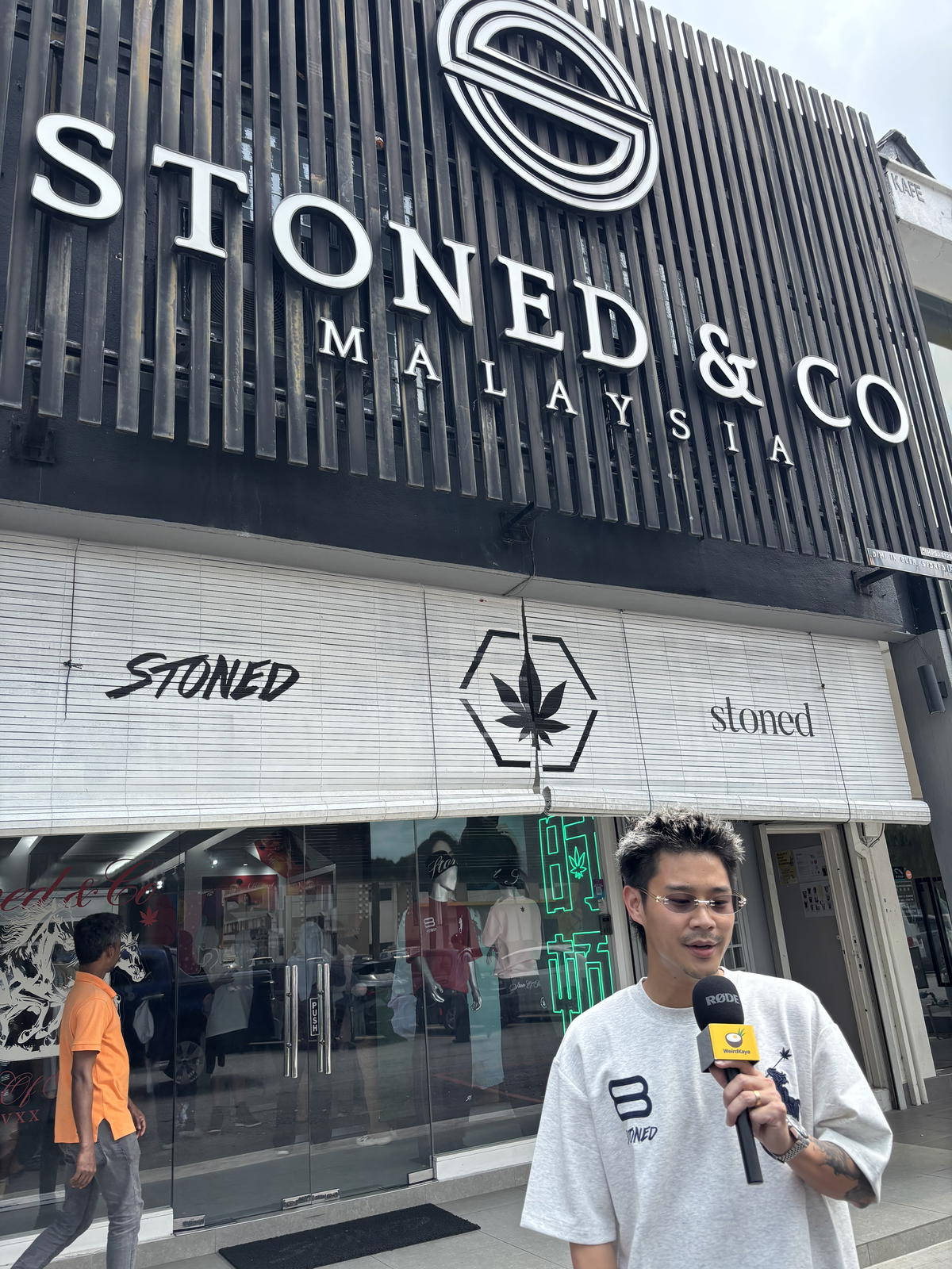 Andrew Ngo standing outside Stoned & Co store