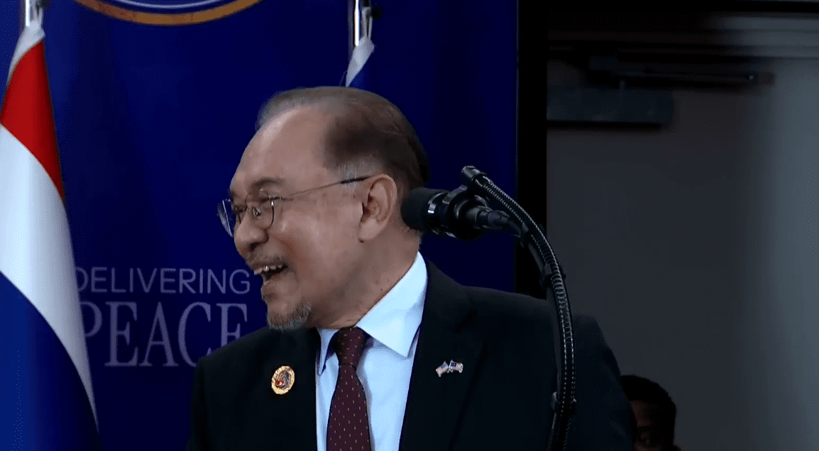 Anwar smiling