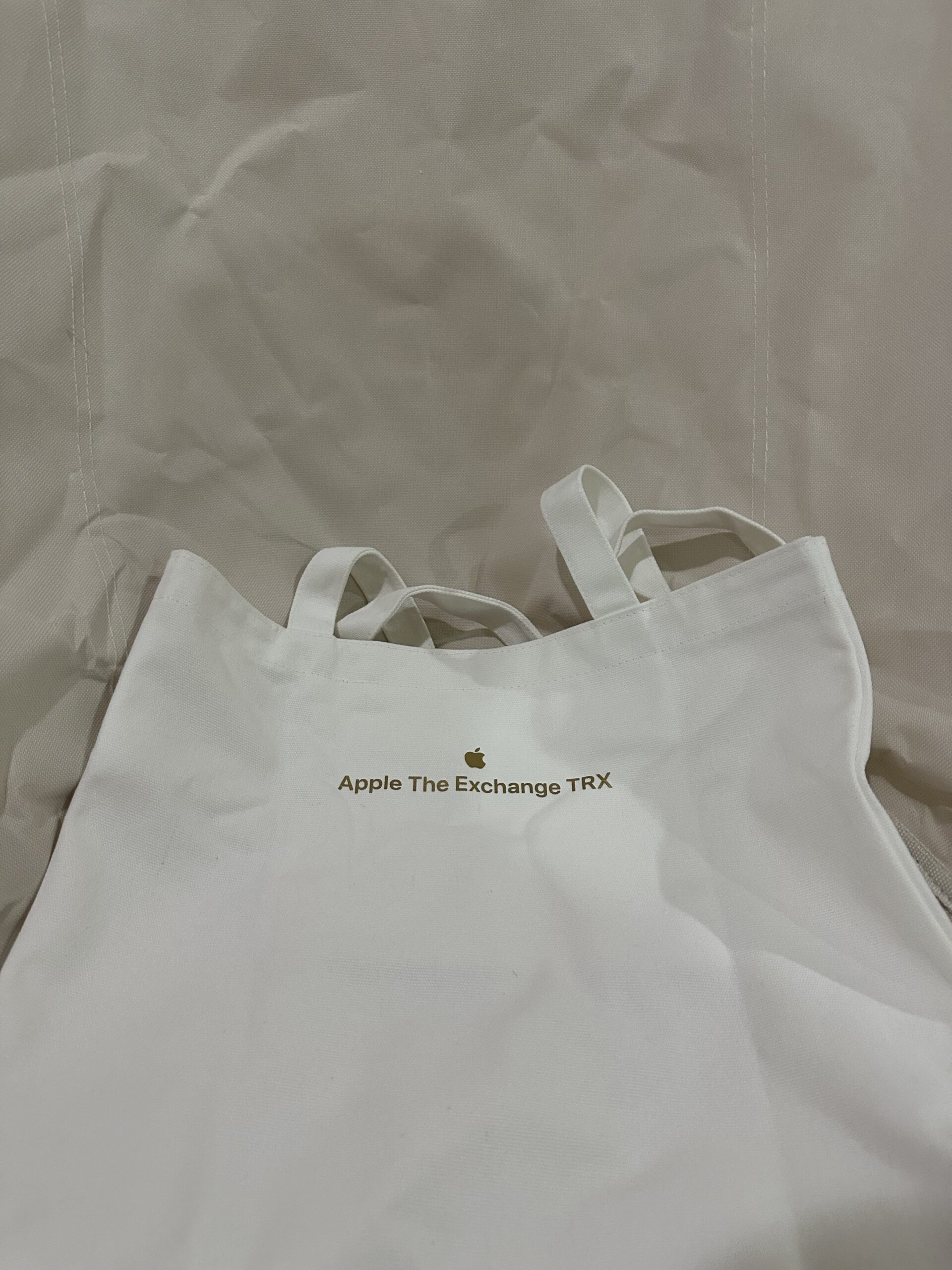Apple tote bag behind view