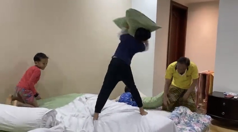 Anwar having pillow fight with grandkids