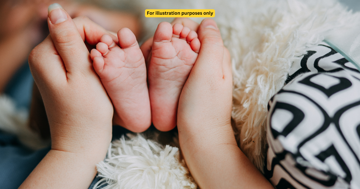 baby feet held