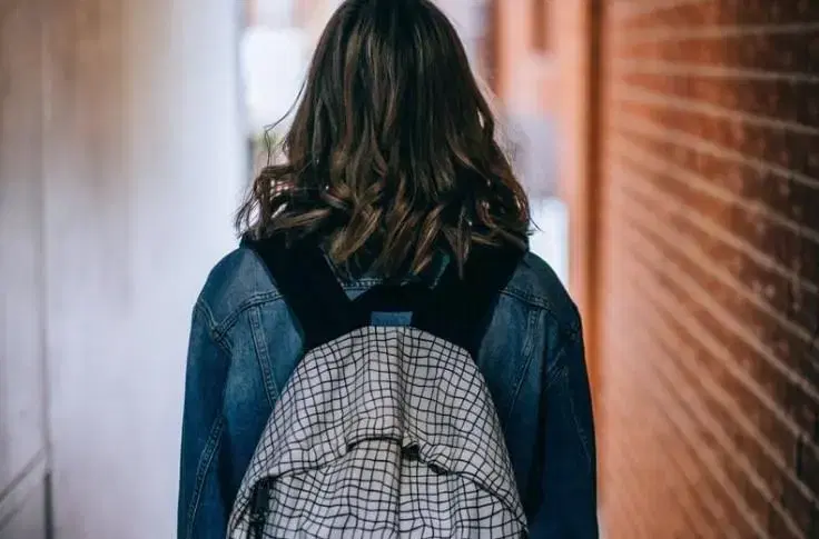Backshot of woman with backpack