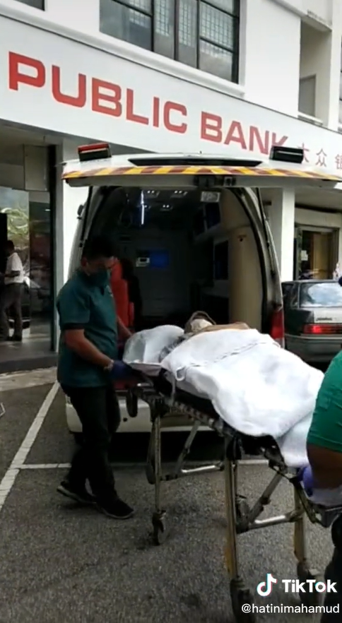 Woman takes bedridden mother to the bank