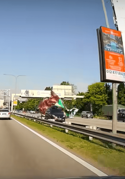 Banner dropping on car (1)