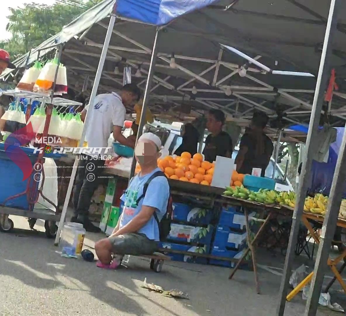 Beggar at night market in jb