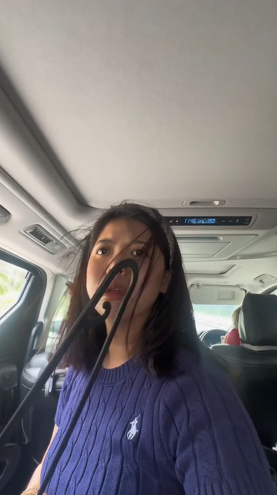 Belle holding a hanger