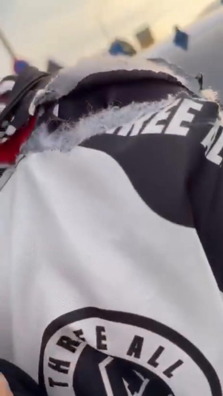 biker strangled kite string slashes neck clothes