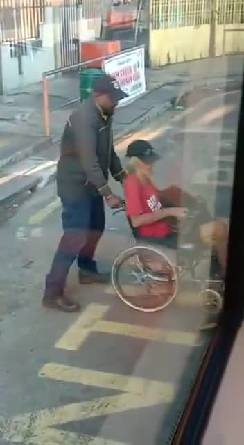 Bus driver helping oku passenger