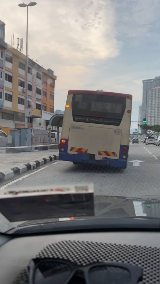 Bus stopping at bus stop at gombak