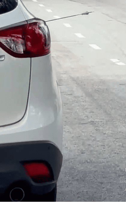 Car door has arrow poking right through