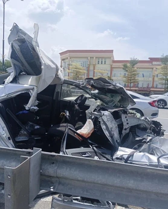 Car totally crushed in road accident in JB