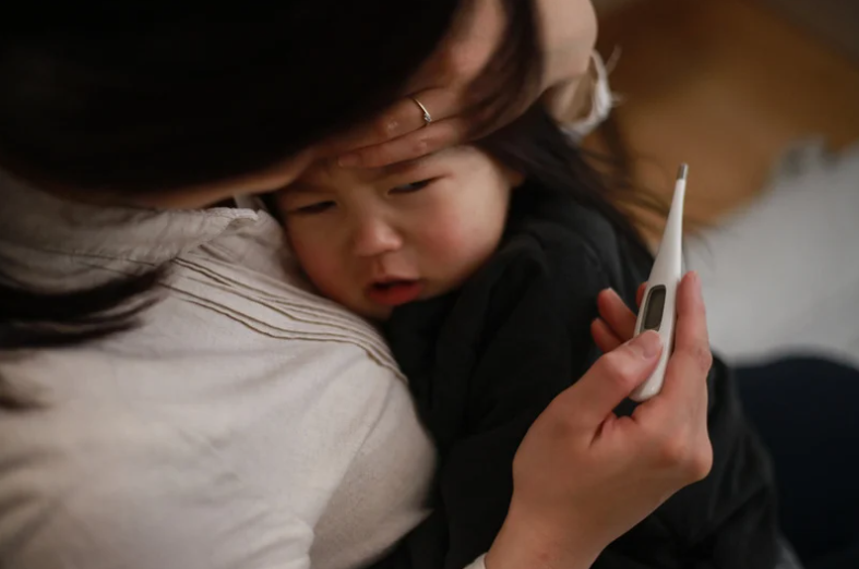 child sick with fever