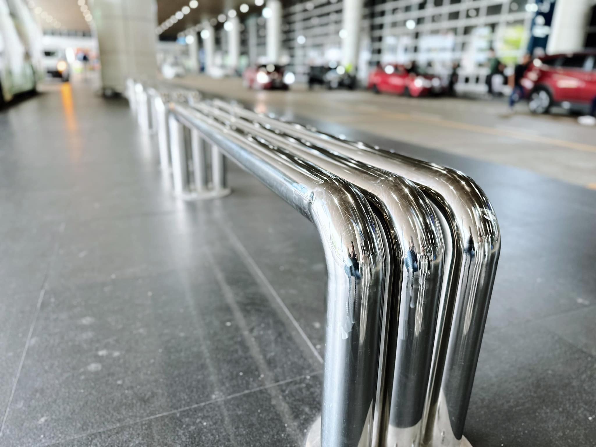 Close-up of metal bench at klia