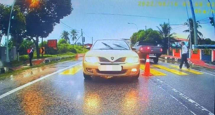 Guard tells student to cross road