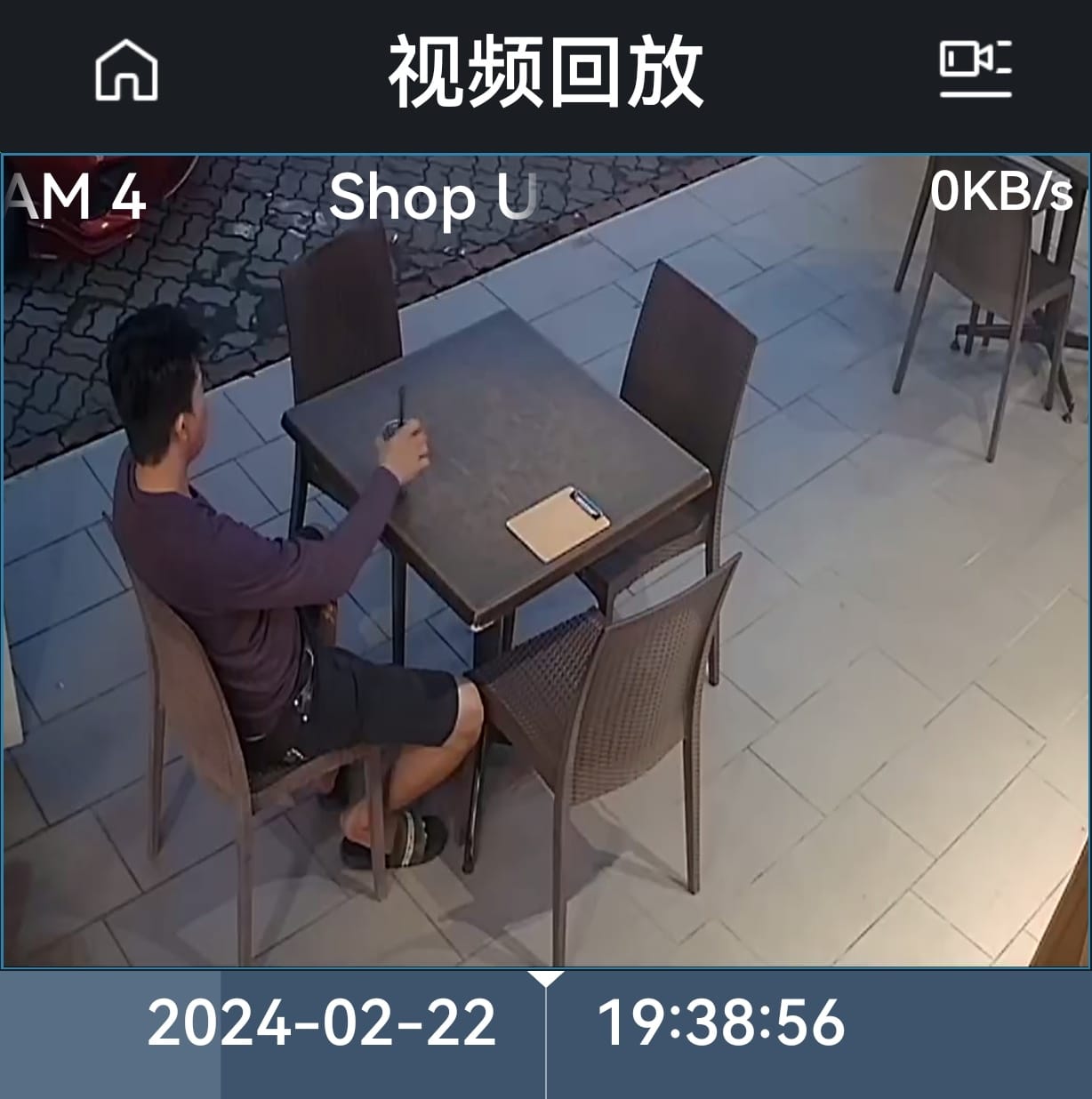 Customer sitting at table outside a restaurant